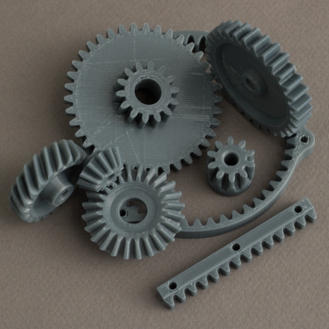 RhinoGears is a plugin that can be used to generate custom gears, including involute gears, racks, bevel gears and helical gears.
