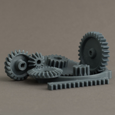 RhinoGears is a plugin that can be used to generate custom gears, including involute gears, racks, bevel gears and helical gears.
